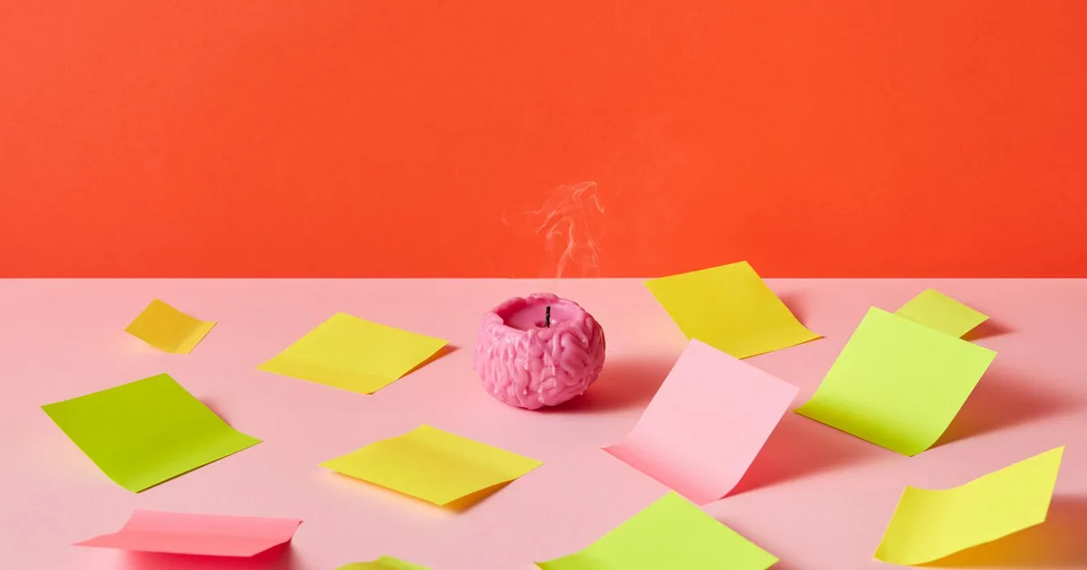 Brain-shaped candle surrounded by colorful sticky notes on a vibrant background, symbolizing creativity and mental clarity.